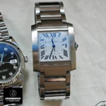 Front view comparison: Super clone vs genuine Cartier Tank Francaise WSTA0067 watch with silver-grained dial and blue steel hands