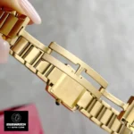 Premium folding clasp mechanism on Cartier-inspired Tank Française gold watch dupe - Secure deployment buckle with logo engraving
