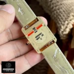 Back view of the Cartier Tank Louis 18K yellow gold WGTA0342 watch dupe, displaying the detailed case back and leather strap attachment