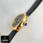 Side view of Cartier Baignoire Gold WGBA0040 watch dupe highlighting the sapphire cabochon crown, a signature Cartier detail.