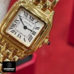 Detailed view of the Panthère de Cartier gold WGPN0047 watch dupe, showcasing its 18K yellow gold case and bracelet.