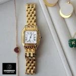 Styled composition of Panthere de Cartier gold WGPN0047 watch dupe alongside matching accessories, highlighting its luxurious design.