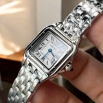 75-degree angle view of the Panthère de Cartier small model WSPN0013 watch dupe, emphasizing its sleek profile and silvered dial