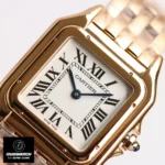 Close-up of the dial on the rose gold Cartier Panthère WGNP0006 watch dupe, featuring blued-steel sword-shaped hands.