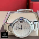 Close-up of the Cartier Ballon Bleu 33mm W4BB0035 watch dupe, highlighting the dial and crown