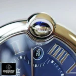 Detailed view of the crown on the Cartier Ballon Bleu 42mm blue dial watch dupe, featuring a synthetic cabochon-shaped spinel.