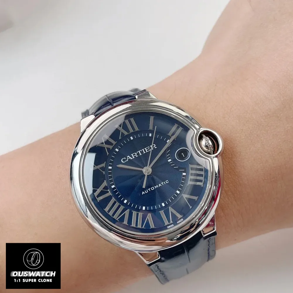 Wrist-worn 42mm watch dupe featuring sunburst blue dial and sword-shaped hands