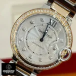 Close-up of the silver diamond dial on the Cartier Ballon Bleu two-tone 33mm watch dupe.
