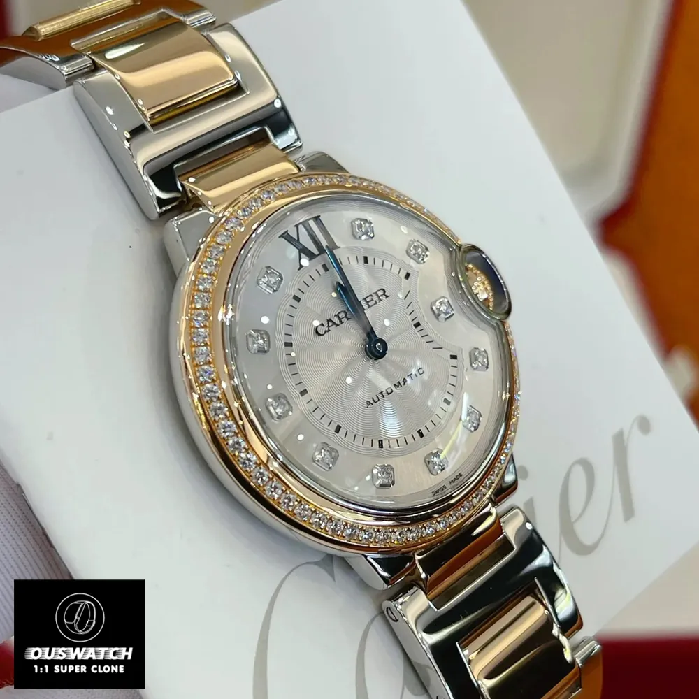 Close-up of the diamond bezel on the Cartier Ballon Bleu two-tone watch dupe.