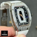 Three‑dimensional front display of the Richard Mille RM 07‑01, combining its iconic tonneau shape with iced out diamond accents.