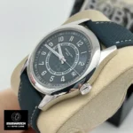 75-degree angled view of the Patek Philippe Calatrava Vintage 6007A dial and case, illustrating the grey-blue embossed pattern and polished finish