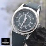 Close-up of the grey-blue Patek Philippe Calatrava 6007A dial, featuring applied white-gold numerals and Super-LumiNova fill