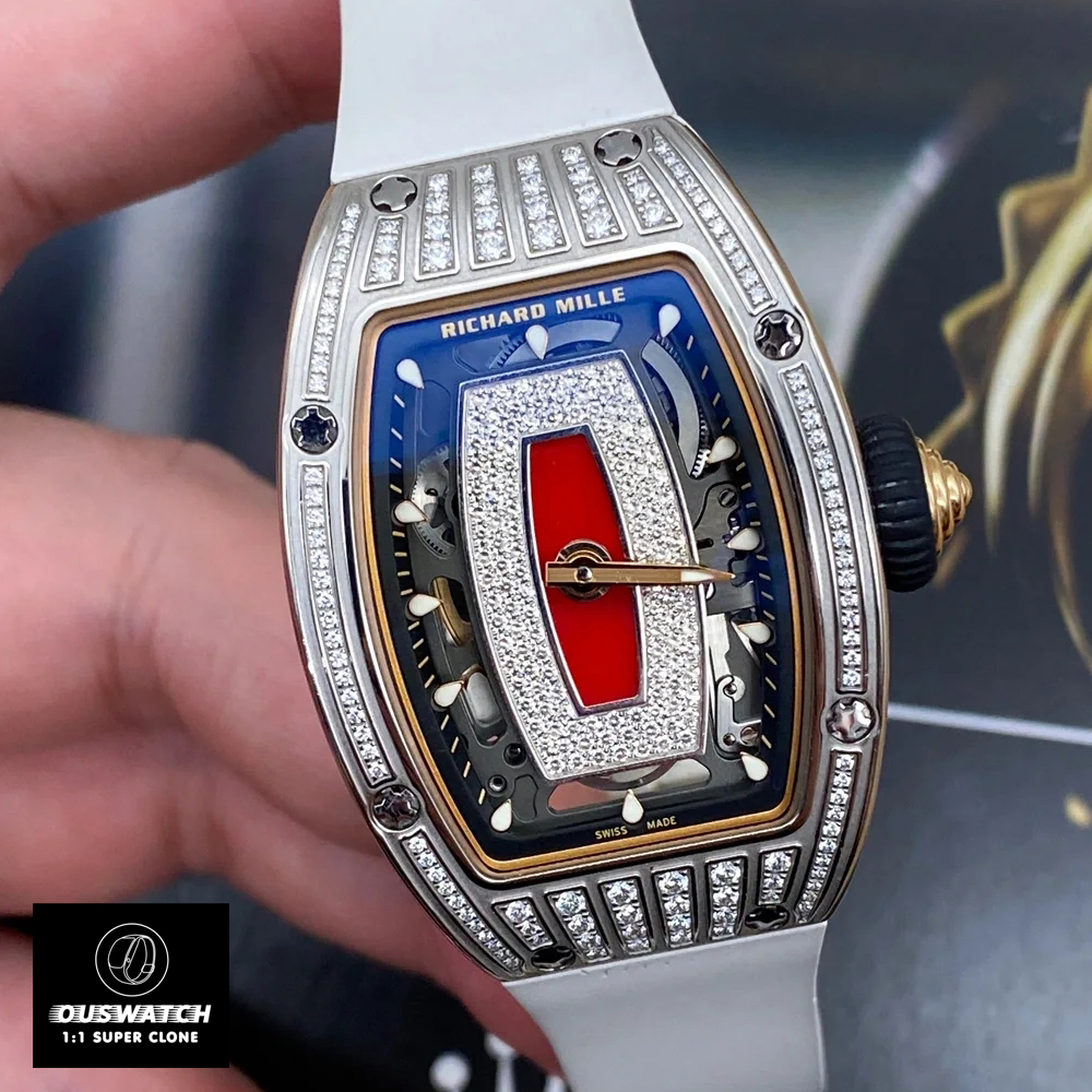 Oblique macro shot of red onyx dial with diamond indexes