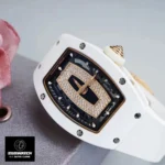 Close‑up of the dial on the Richard Mille RM 07 White Ceramic, showing the black onyx and diamond inlay of this iced out watch replica.