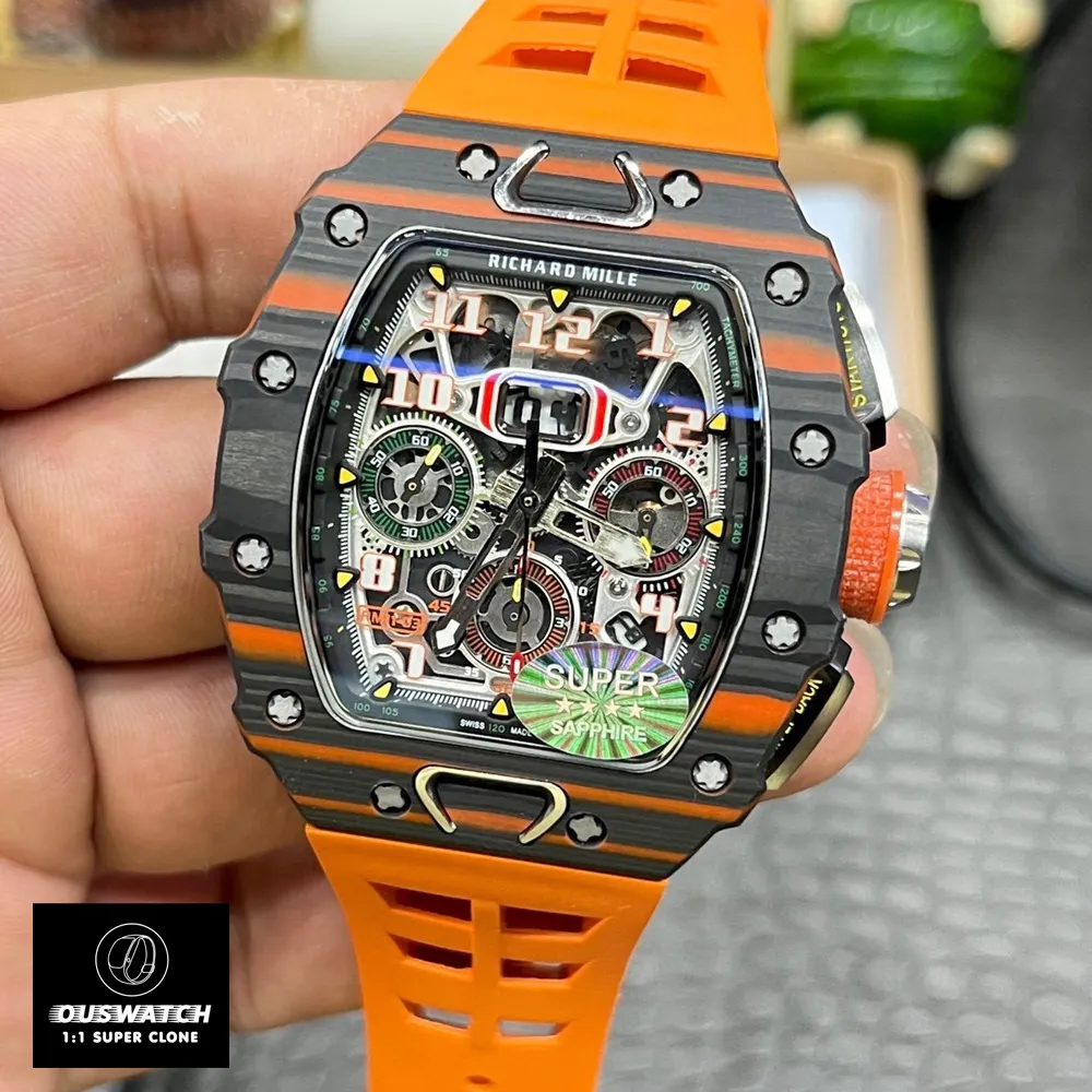 75° close‑up of the Richard Mille RM 11‑03 McLaren chronograph: beneath the sapphire crystal, the RMAC3 movement’s chamfered finishing and Paraflex shock absorbers are clearly visible