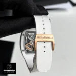 White rubber strap with rose gold deployant clasp on the Richard Mille RM 07-01 super clone watch, showcasing premium material and 1:1 craftsmanship.