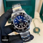 120-degree panoramic view of Rolex Deepsea 136660 Super Clone's D-Blue gradient dial. Captures the transition from blue to black and the iconic "DEEPSEA" green text.