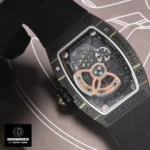 Transparent case back of the RM 07-01 displaying the CRMA2 calibre’s skeletonized baseplate and bridges in grade 5 titanium. The variable-inertia rotor with 5N red gold segments and ceramic ball bearings is visible, illustrating the movement’s technical sophistication