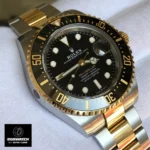 On-wrist demonstration of black dial Deepsea with two-tone bracelet and 60-minute dive scale