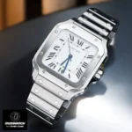 Cartier Santos Medium WSSA0029 Super Clone watch placed flat on a desk, showing its polished steel case and bracelet