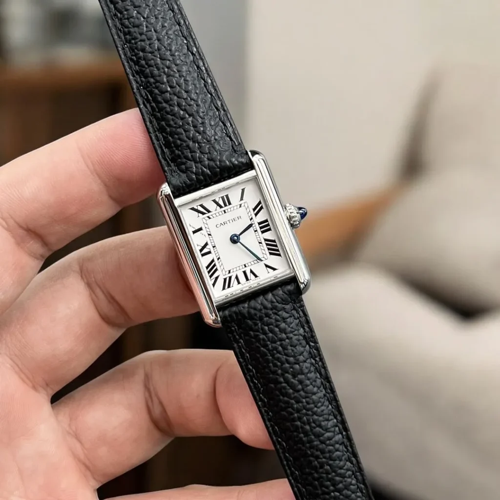 Three-dimensional 120-degree view of Cartier Tank Must WSTA0042, showcasing rectangular stainless steel case, silvered opaline dial, and iconic Roman numeral markers.