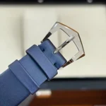 Macro shot of the pin-style buckle on the Patek Philippe Ladies Calatrava 4997/200G Super Clone strap, highlighting its polished finish and precise engraving.