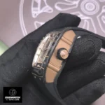 Macro view of the RM 07-01’s rose gold crown with black rubber inserts. The fluted design ensures secure grip for time adjustments, while the integrated guards protect against accidental impacts