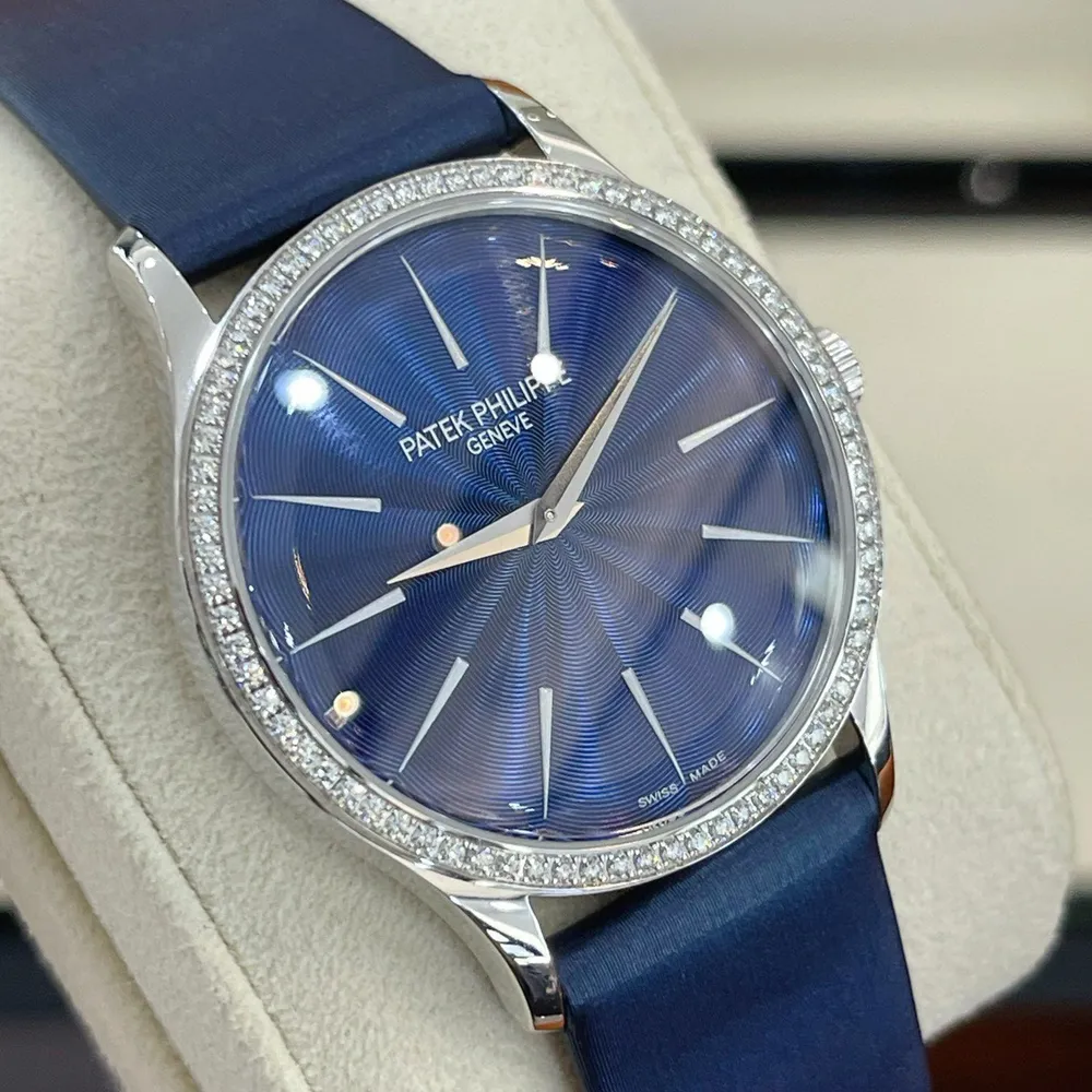 Close-up of Patek Philippe Calatrava 4997/200G replica’s diamond-studded bezel and sunburst blue dial.