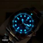 Chromalight luminescent markers and hands glowing blue in low-light conditions