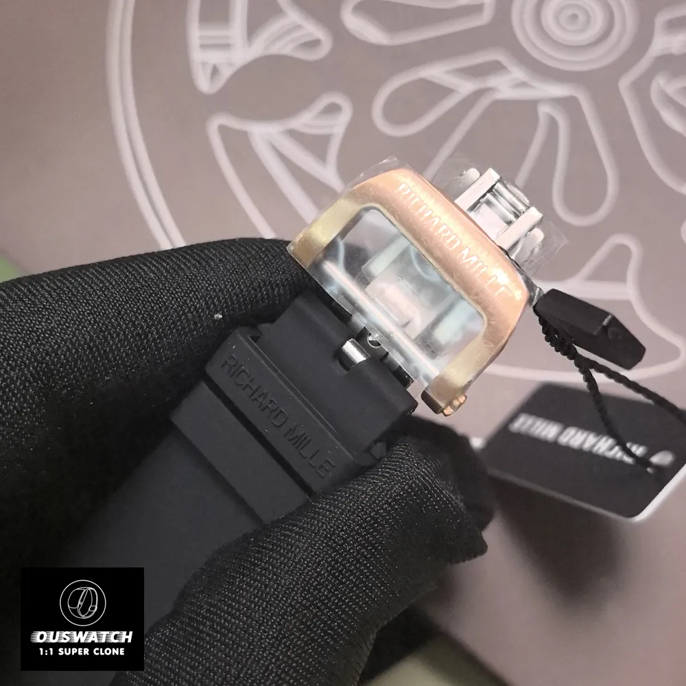 Detailed look at the RM 07-01’s rose gold pin buckle, featuring a sandblasted finish and engraved Richard Mille logo. The buckle’s streamlined design ensures secure fastening without compromising the strap’s clean lines