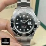 Front view of high-precision timepiece inspired by Rolex Sea-Dweller design, featuring black dial and Cerachrom bezel