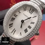 Close-up of Cartier Baignoire WJBA0020 silver dial with Roman numerals and blued-steel hands.