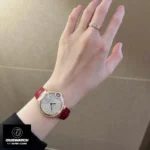 Cartier Ballon Bleu WJBB0080 33mm watch worn on a woman’s wrist, showcasing its elegant rose gold finish.