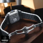Exhibition caseback and unfolded clasp of the Cartier Santos WSSA0029 Super Clone watch, revealing the automatic movement clone and steel folding buckle