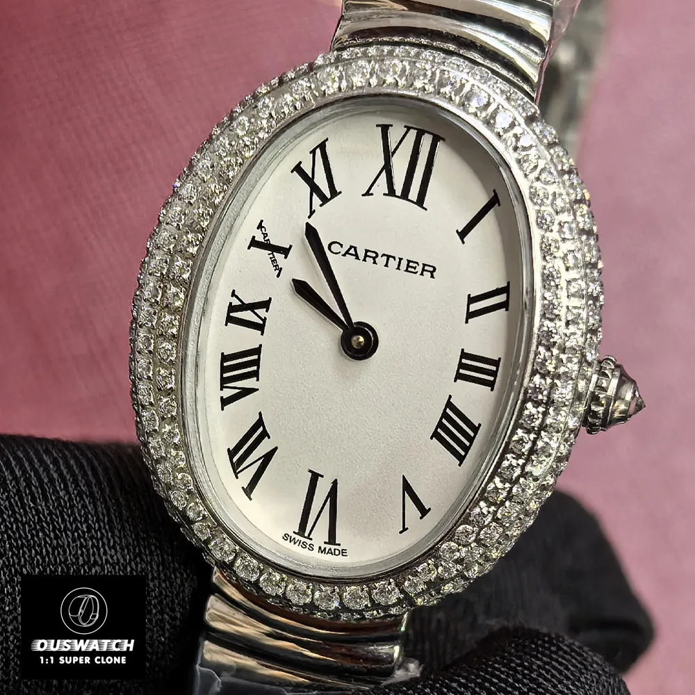 Close-up of Cartier Baignoire WJBA0020 silver dial with Roman numerals and blued-steel hands.