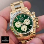 Hand holding a super clone Rolex Daytona 126508 in 18K yellow gold, emphasizing its robust oyster case and smooth bezel.
