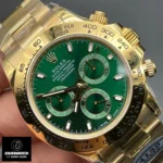 Extreme close-up of the green dial on the John Mayer Rolex Daytona 116508 super clone, showing date subdial and gold hands.
