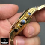 Side-profile detail of the Rolex Daytona 116508 super clone, focusing on the fluted crown and gold chronograph pushers.
