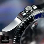 Crown detail of Rolex GMT‑Master II Batman 126710BLNR‑0003 super clone, showcasing the fluted Triplock winding crown and polished crown guards in Oystersteel.