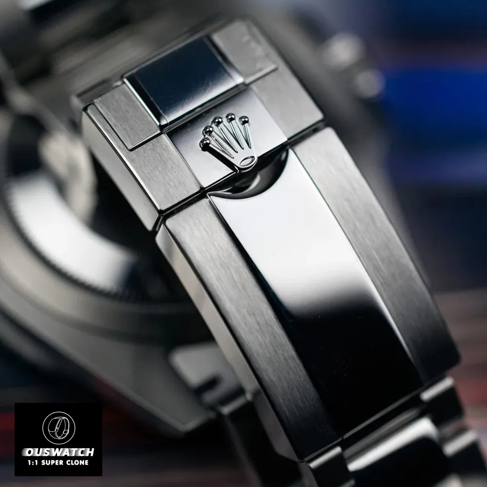 Folding Oysterlock clasp of the Rolex GMT‑Master II Batman super clone, showing its safety catch, micro‑adjustment Easylink extension, and engraved Rolex coronet.