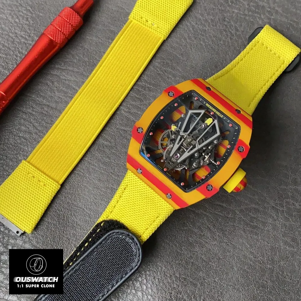 Richard Mille RM 27‑03 Rafael Nadal edition super clone watch laid flat on a desk, showcasing its yellow TPT® strap.