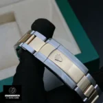 Folding clasp detail of the Rolex Datejust 41mm two-tone watch, showing the polished and brushed finishing.