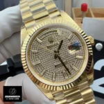 Rolex iced-out Day-Date 40 yellow gold watch (228238-0054) shown at a 120-degree angle, highlighting the case shape and shine.
