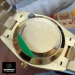 Back view of the Rolex iced-out Day-Date 40 with diamond dial, model M228238-0054, showing caseback and bracelet.