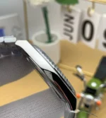 Rolex Land‑Dweller m127336 platinum watch side view showcasing brushed finish