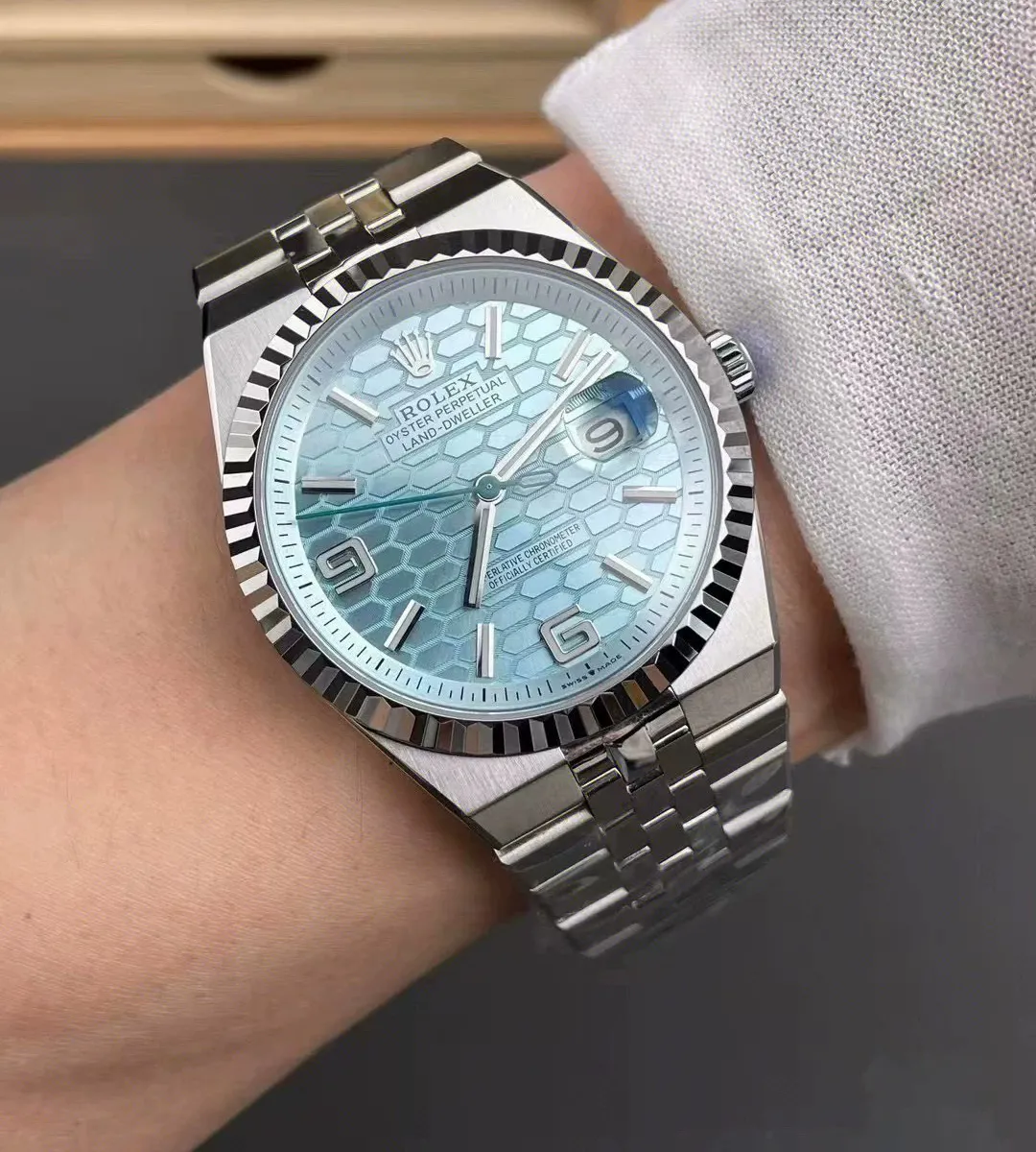Wearing the Replica Rolex Land‑Dweller m127336 platinum watch on the wrist