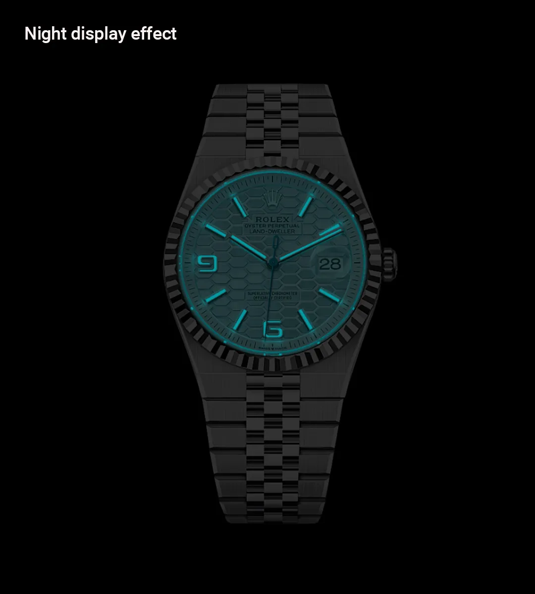 Replica Rolex Land‑Dweller Ice Blue dial glowing in low‑light conditions