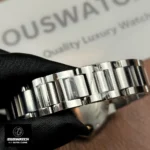 Close-up of the two-tone 33mm Cartier Ballon Bleu bracelet showing polished rose gold center links and stainless steel outer links