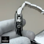 Close-up of the Rolex Daytona 126509 crown and case craftsmanship.