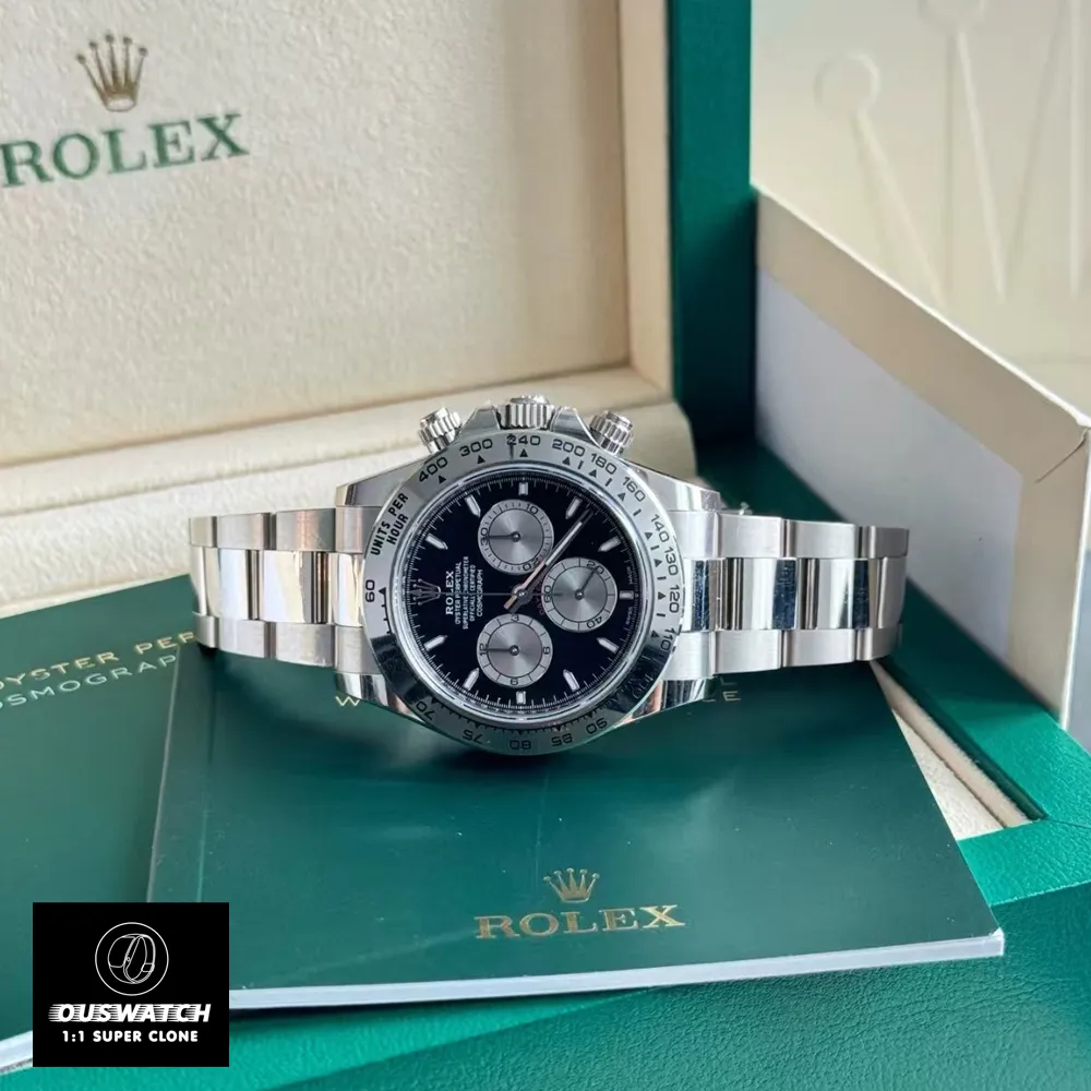 Rolex Daytona 126509 black dial steel men’s watch on green presentation box.